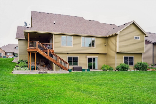 4014 NE Bellagio Cir, Ankeny, IA 50021 - rear view of property with stairs, a lawn, a deck, and a shingled roof