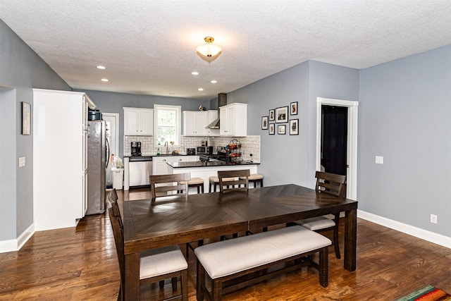 2212 228th Pl, Ames, IA 50014 - dining area with dark wood-style flooring, a textured ceiling, baseboards, and recessed lighting