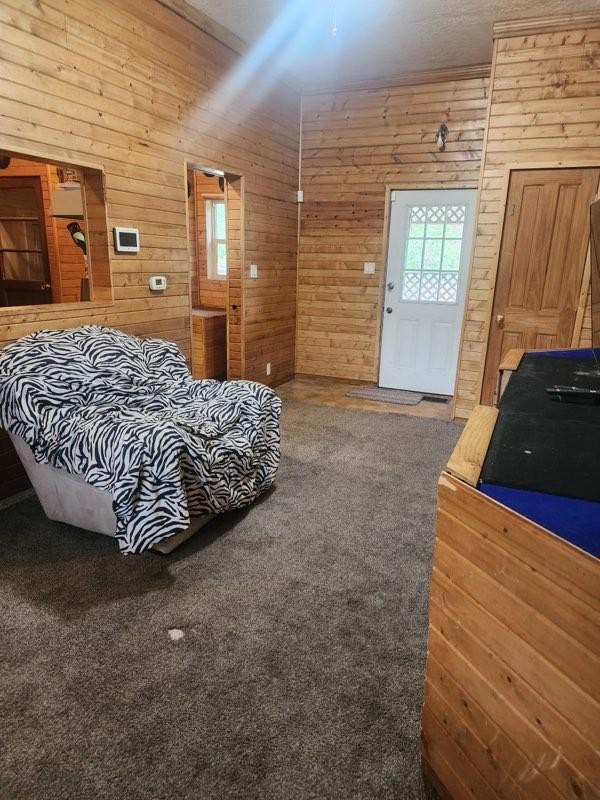 1512 Osceola Ave, Chariton, IA 50049 - bedroom with wooden walls
