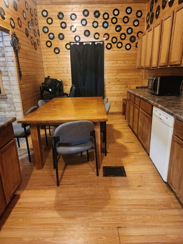 1512 Osceola Ave, Chariton, IA 50049 - office area featuring light wood-style flooring and wood walls