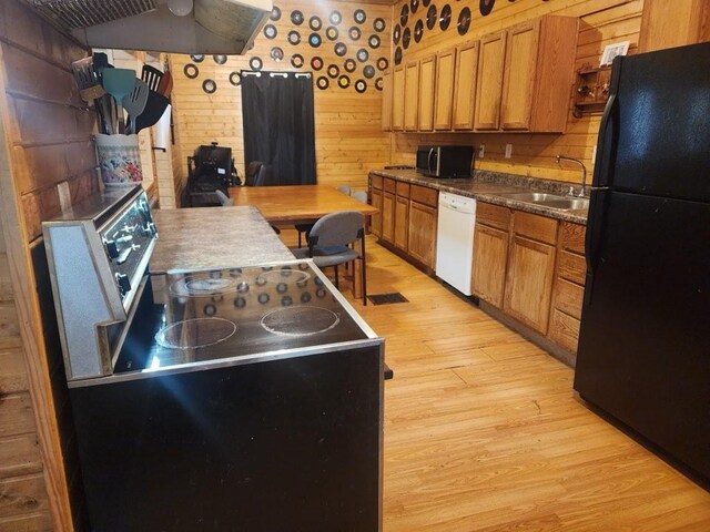 1512 Osceola Ave, Chariton, IA 50049 - kitchen featuring freestanding refrigerator, electric range, white dishwasher, a sink, and stainless steel microwave