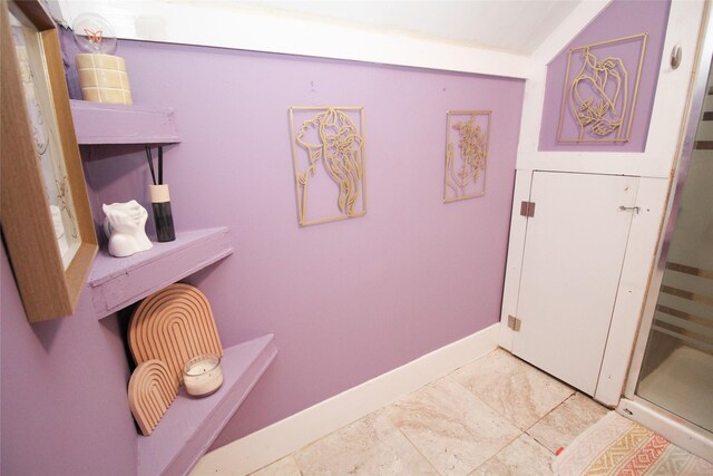 1035 65th St, Windsor Heights, IA 50324 - bathroom with baseboards and a shower stall