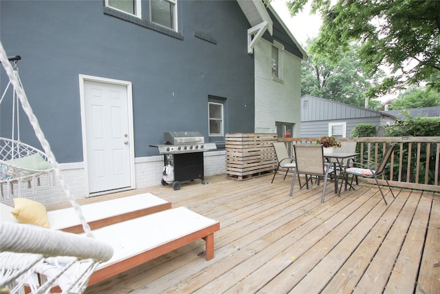 1035 65th St, Windsor Heights, IA 50324 - wooden deck with area for grilling and outdoor dining space