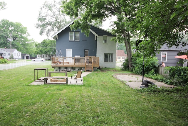 1035 65th St, Windsor Heights, IA 50324 - back of house with a deck and stucco siding