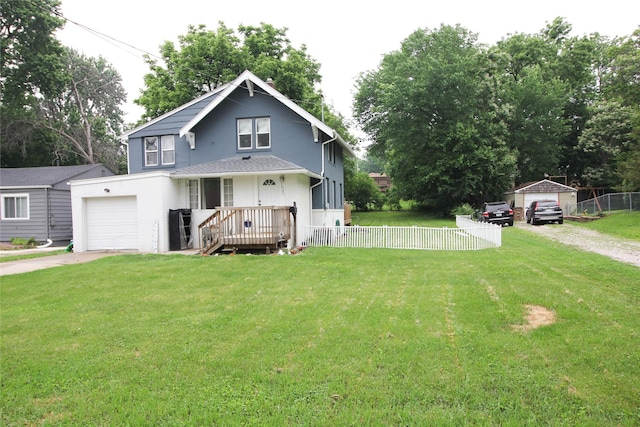 1035 65th St, Windsor Heights, IA 50324 - view of front of house featuring driveway, an attached garage, and stucco siding