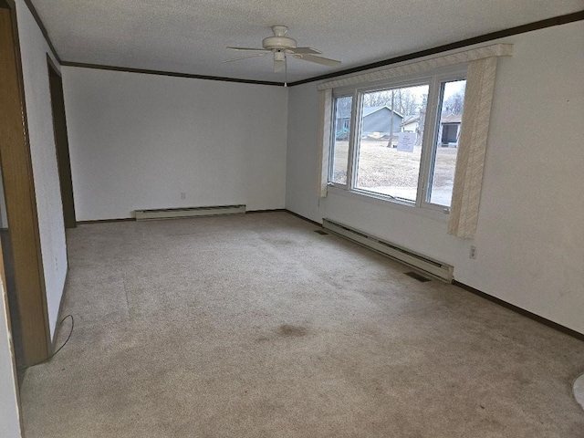 205 Amy Ln, Mount Ayr, IA 50854 - unfurnished room with a baseboard heating unit, a baseboard radiator, ceiling fan, carpet, and crown molding