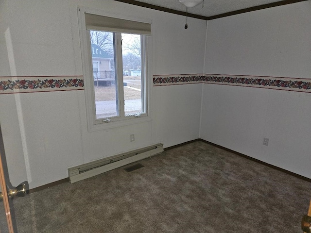 205 Amy Ln, Mount Ayr, IA 50854 - spare room with baseboard heating, dark carpet, and a wainscoted wall