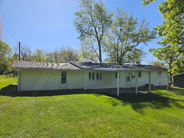 205 Amy Ln, Mount Ayr, IA 50854 - back of house featuring a lawn