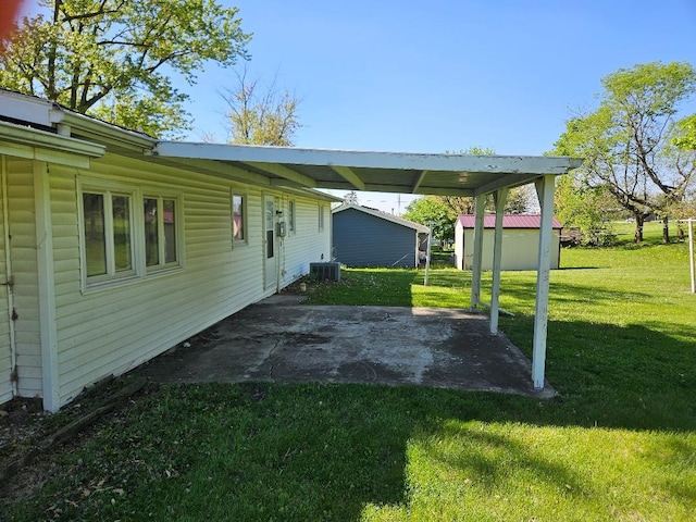 205 Amy Ln, Mount Ayr, IA 50854 - view of parking / parking lot with a shed