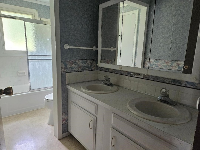 205 Amy Ln, Mount Ayr, IA 50854 - full bath with double vanity, bath / shower combo with glass door, and tasteful backsplash