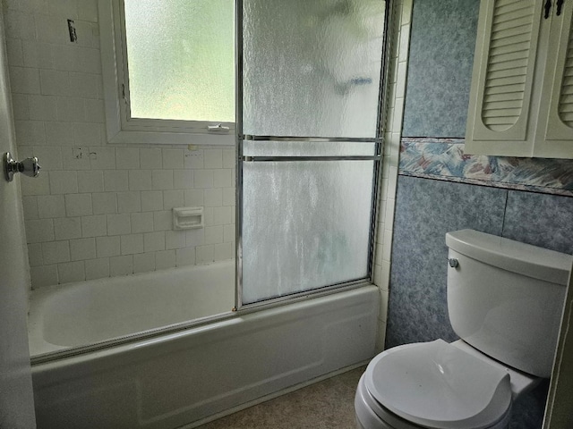 205 Amy Ln, Mount Ayr, IA 50854 - bathroom with combined bath / shower with glass door and tile walls