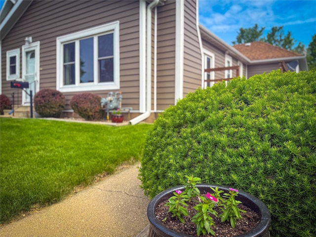 1545 5th St, Boone, IA 50036 - view of home's exterior with a yard