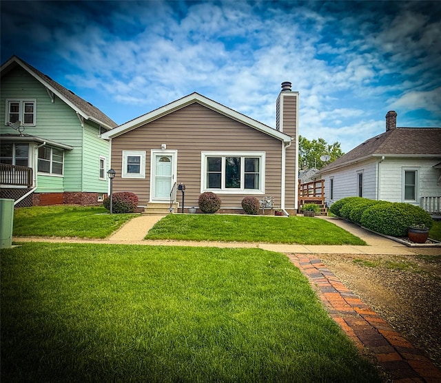 1545 5th St, Boone, IA 50036 - view of front of property featuring entry steps, a front yard, and a chimney