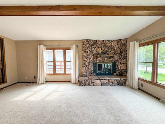 1545 5th St, Boone, IA 50036 - unfurnished living room featuring healthy amount of natural light, carpet, baseboards, and beamed ceiling