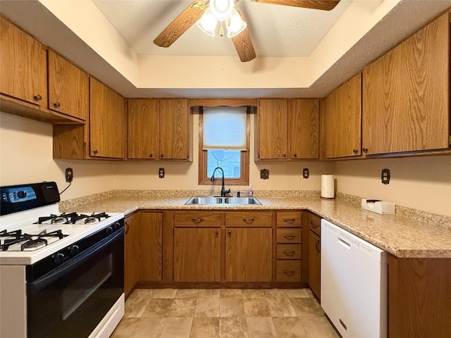 1545 5th St, Boone, IA 50036 - kitchen with range with gas cooktop, a sink, white dishwasher, and brown cabinets