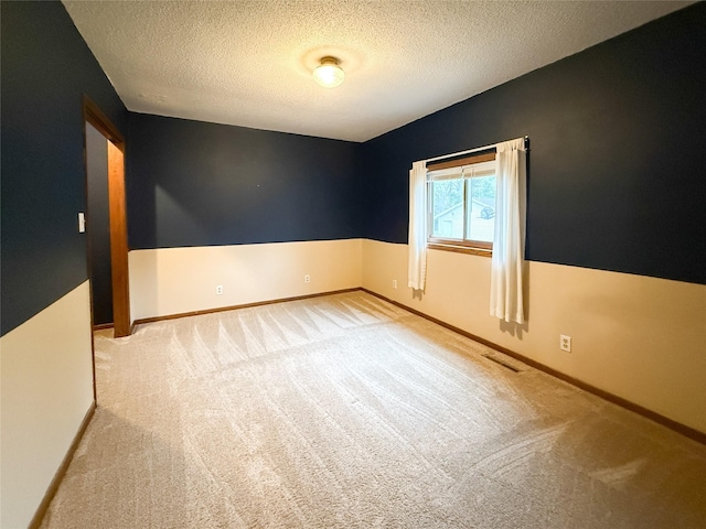 1545 5th St, Boone, IA 50036 - carpeted spare room featuring a textured ceiling and baseboards