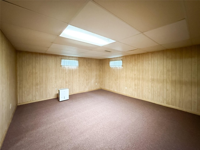1545 5th St, Boone, IA 50036 - below grade area featuring a drop ceiling, carpet floors, and wood walls