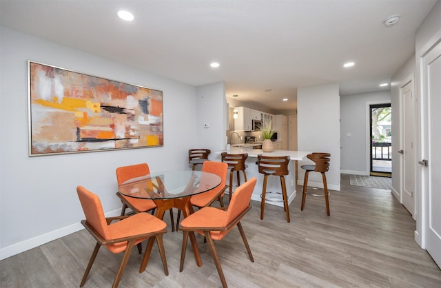 6196 Terrace Dr Unit 2, Johnston, IA 50131 - dining room featuring recessed lighting, light wood-type flooring, and baseboards