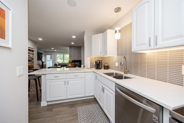 6196 Terrace Dr Unit 2, Johnston, IA 50131 - kitchen featuring dishwasher, a sink, a peninsula, wood finished floors, and open floor plan
