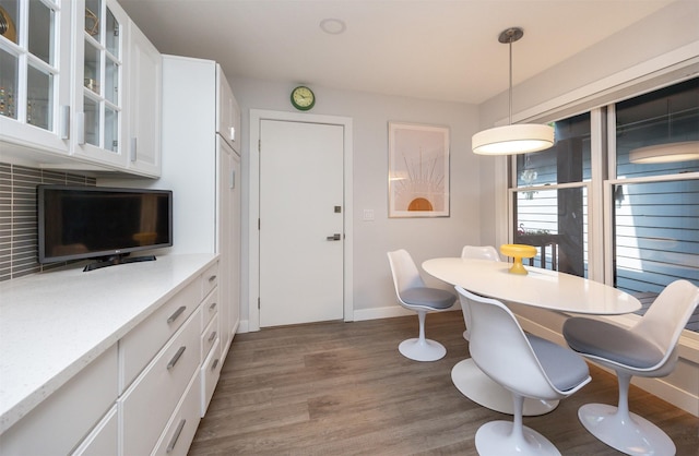 6196 Terrace Dr Unit 2, Johnston, IA 50131 - dining area with baseboards and wood finished floors