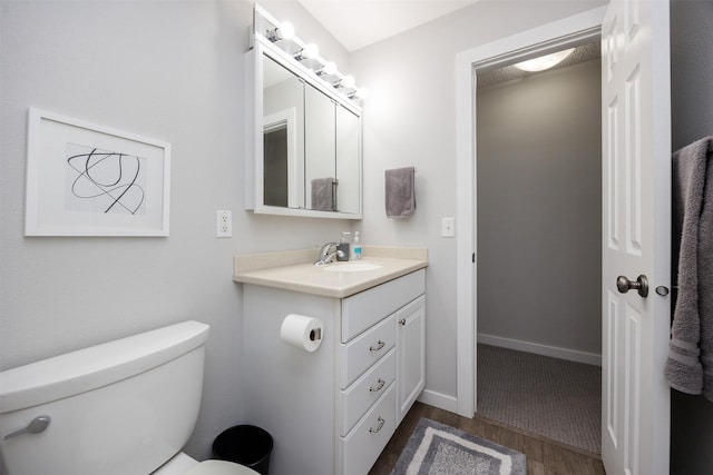 6196 Terrace Dr Unit 2, Johnston, IA 50131 - half bathroom featuring wood finished floors, toilet, and vanity