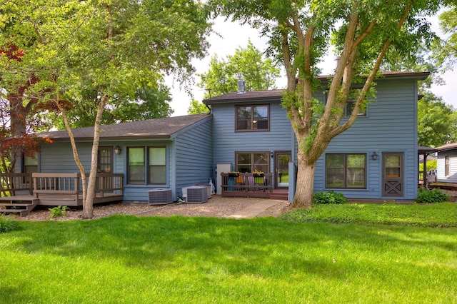 6196 Terrace Dr Unit 2, Johnston, IA 50131 - rear view of house with a deck, a lawn, and central AC