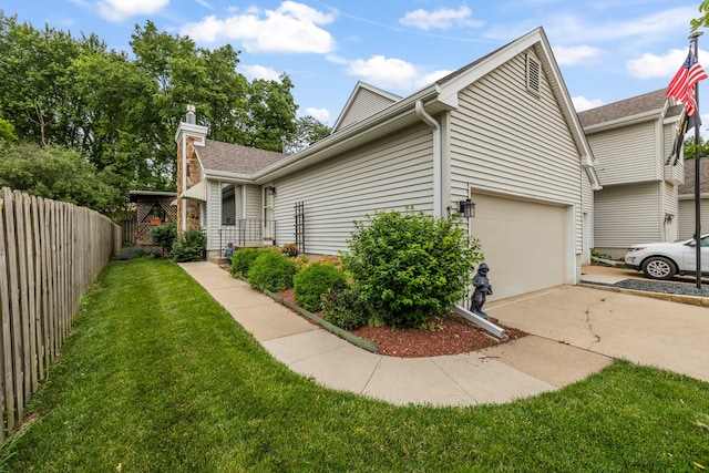 3916 92nd Dr, Urbandale, IA 50322 - view of property exterior featuring concrete driveway, an attached garage, and a chimney
