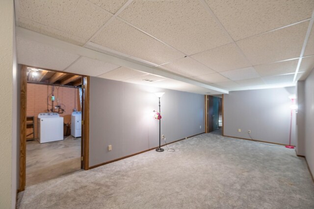 3916 92nd Dr, Urbandale, IA 50322 - finished below grade area featuring carpet flooring, a paneled ceiling, and washer and dryer
