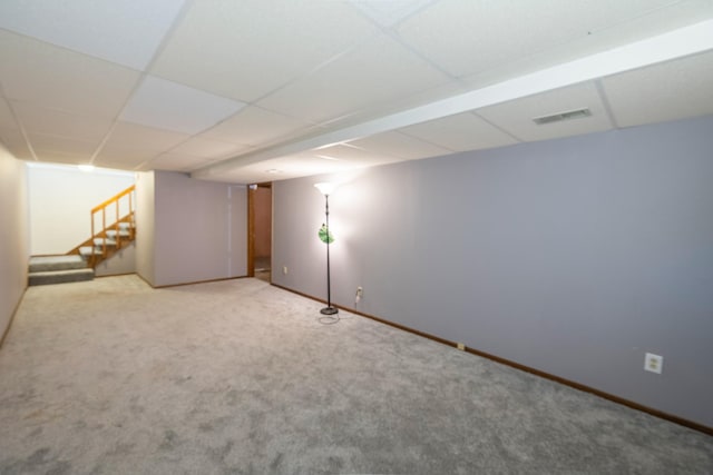 3916 92nd Dr, Urbandale, IA 50322 - finished basement with stairs, carpet floors, and a paneled ceiling