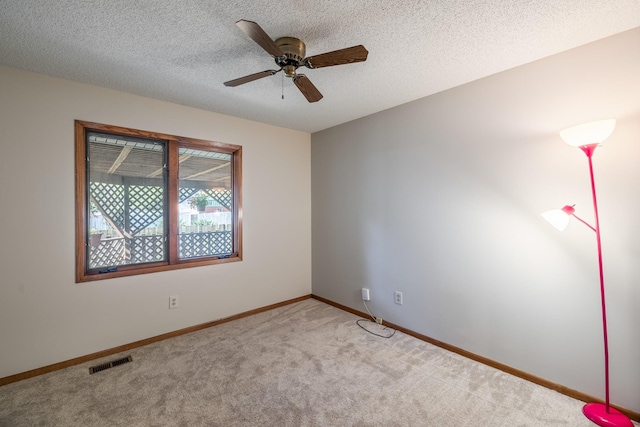3916 92nd Dr, Urbandale, IA 50322 - carpeted empty room featuring ceiling fan and a textured ceiling