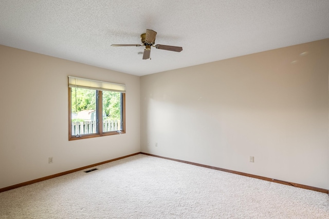 3916 92nd Dr, Urbandale, IA 50322 - carpeted empty room with a ceiling fan and a textured ceiling