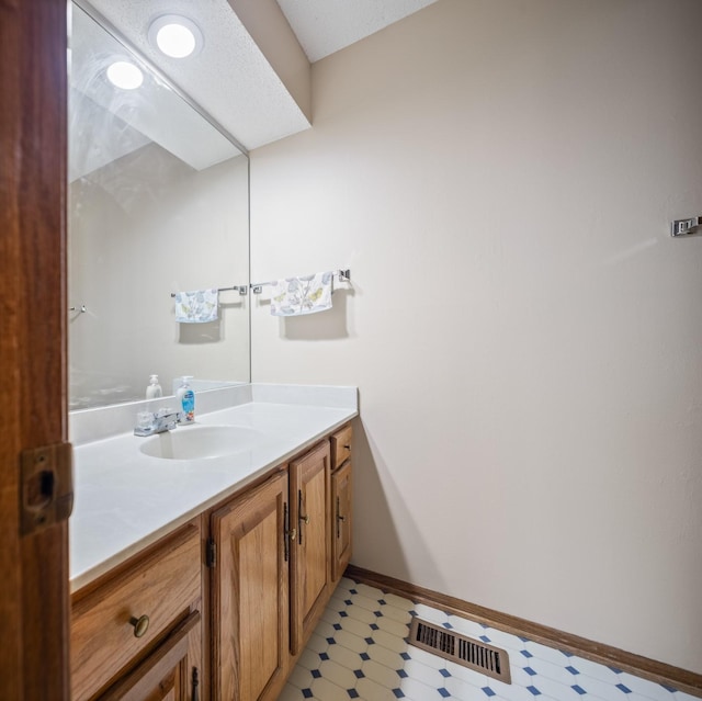 3916 92nd Dr, Urbandale, IA 50322 - bathroom featuring vanity and tile patterned floors