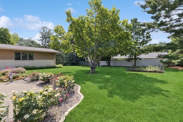 2110 Ashmore Dr, Ames, IA 50014 - view of yard featuring a vegetable garden