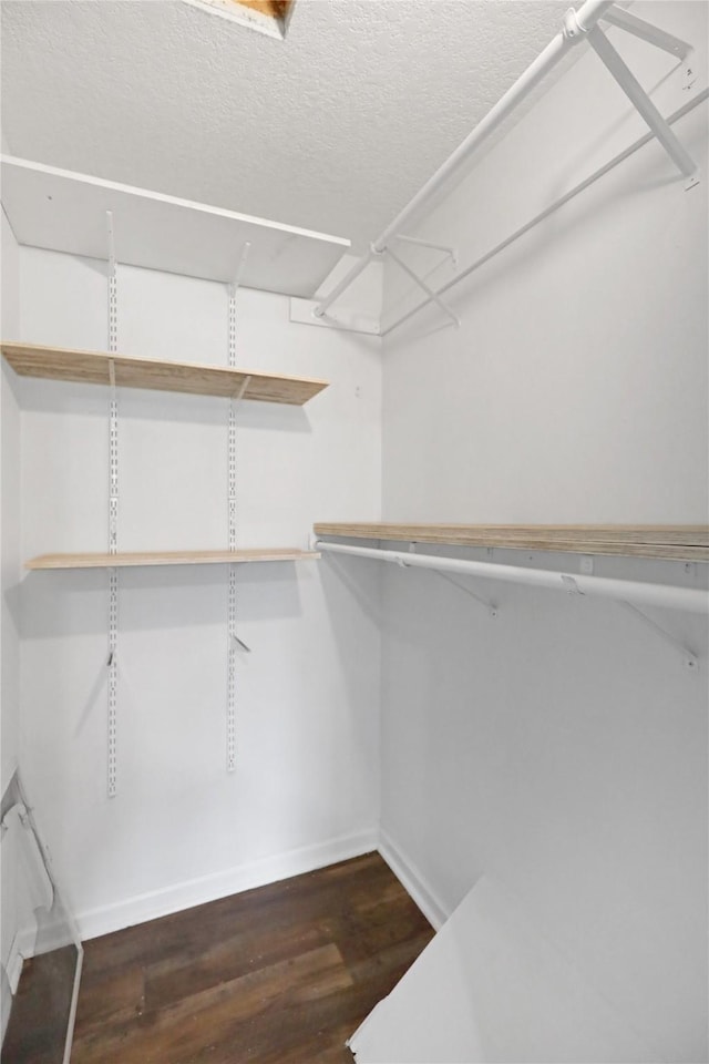 1908 E Walnut St, Des Moines, IA 50316 - spacious closet with dark wood-type flooring