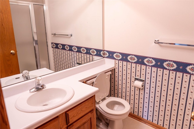 1126 SE Mallard Creek Dr, Ankeny, IA 50021 - full bathroom with wallpapered walls, a stall shower, vanity, toilet, and wainscoting