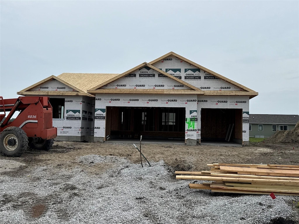 401 NE Chalet St, Elkhart, IA 50073 - unfinished property with a garage