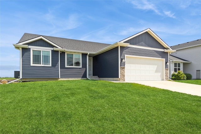 602 NE 57th St, Ankeny, IA 50021 - ranch-style home featuring a front lawn, an attached garage, driveway, and board and batten siding