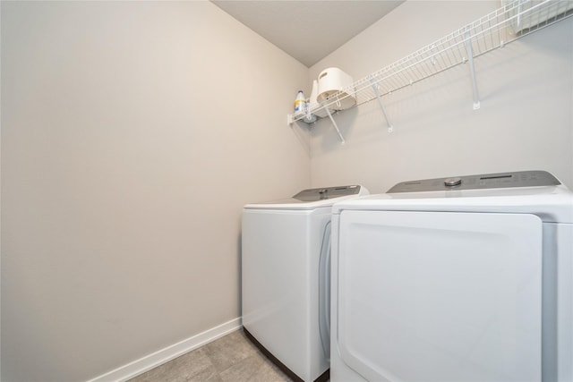 602 NE 57th St, Ankeny, IA 50021 - laundry room with washer and dryer and baseboards