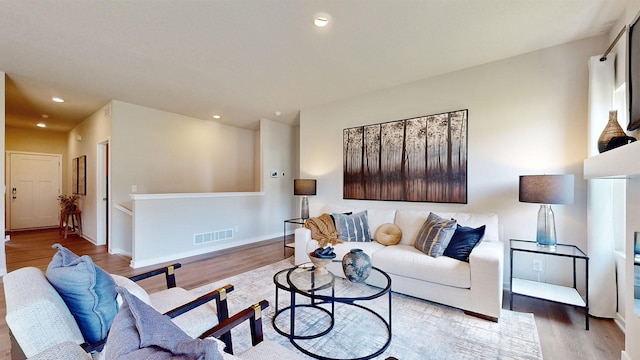 484 Kinley Dr, Waukee, IA 50263 - living room featuring wood finished floors, recessed lighting, and baseboards