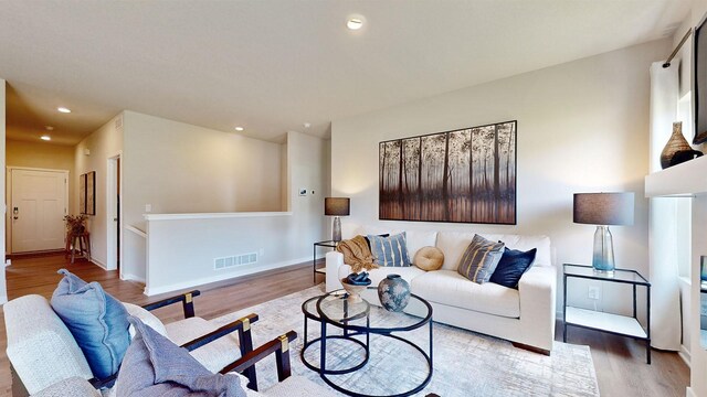 480 Kinley Dr, Waukee, IA 50263 - living room featuring wood finished floors, recessed lighting, and baseboards