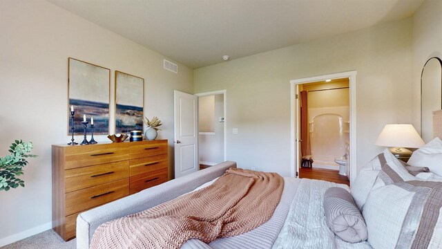 480 Kinley Dr, Waukee, IA 50263 - bedroom with ensuite bathroom and baseboards