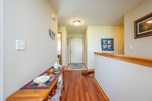 168 SE Sweetgrass Ln, Pleasant Hill, IA 50327 - hall featuring wood finished floors and baseboards
