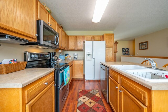 168 SE Sweetgrass Ln, Pleasant Hill, IA 50327 - kitchen with stainless steel appliances, dark wood finished floors, and light countertops