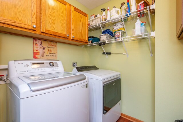 168 SE Sweetgrass Ln, Pleasant Hill, IA 50327 - washroom featuring cabinet space and washer and clothes dryer