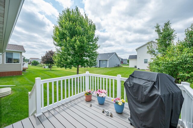 168 SE Sweetgrass Ln, Pleasant Hill, IA 50327 - deck with grilling area, a lawn, and a residential view