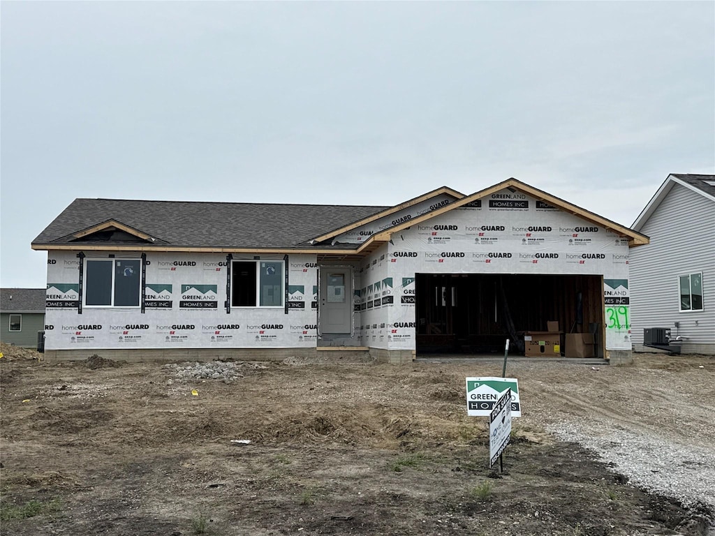 319 NE Chalet St, Elkhart, IA 50073 - property under construction featuring a garage, a shingled roof, and dirt driveway