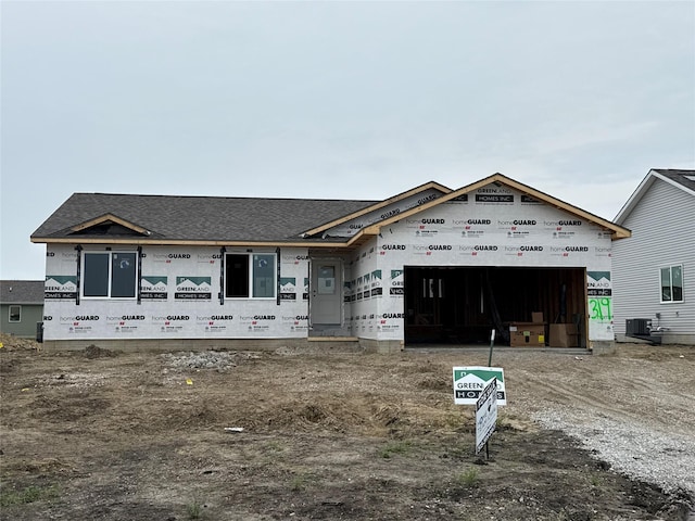 319 NE Chalet St, Elkhart, IA 50073 - property under construction featuring a garage, a shingled roof, and dirt driveway