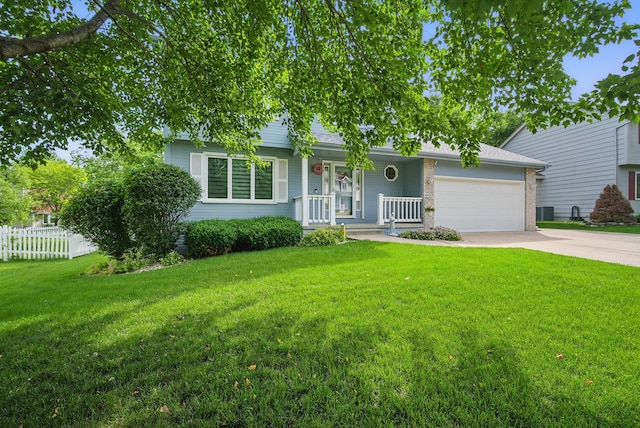 4623 62nd St, Urbandale, IA 50322 - view of front of home featuring an attached garage, driveway, covered porch, and brick siding