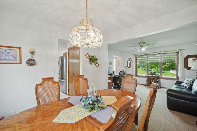 4623 62nd St, Urbandale, IA 50322 - dining room featuring a chandelier, a ceiling fan, and carpet flooring