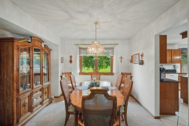 4623 62nd St, Urbandale, IA 50322 - dining room with a chandelier, light colored carpet, and a textured ceiling